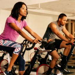 people on exercise bikes