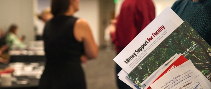 close up of papers being held with a blurry background