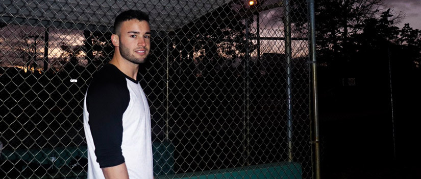 Chandler Engel is pictured after a baseball practice on the ball field at sunset.
