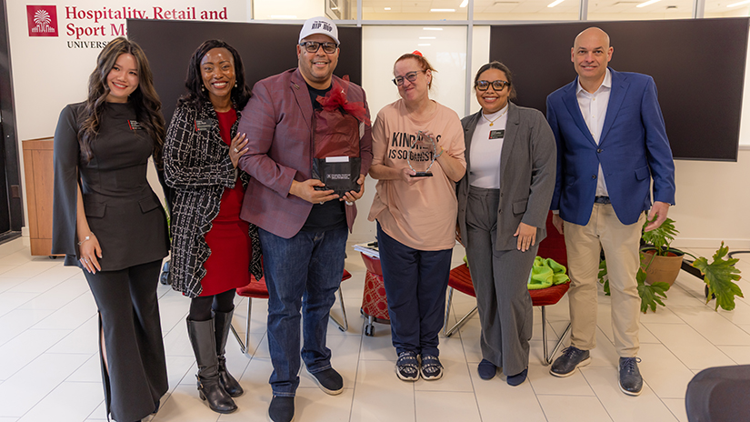 Dean Michael Sagas and Vice Dean Erica Lake pose with keynote speaker Wendy Day and moderator C. Keith Harrison
