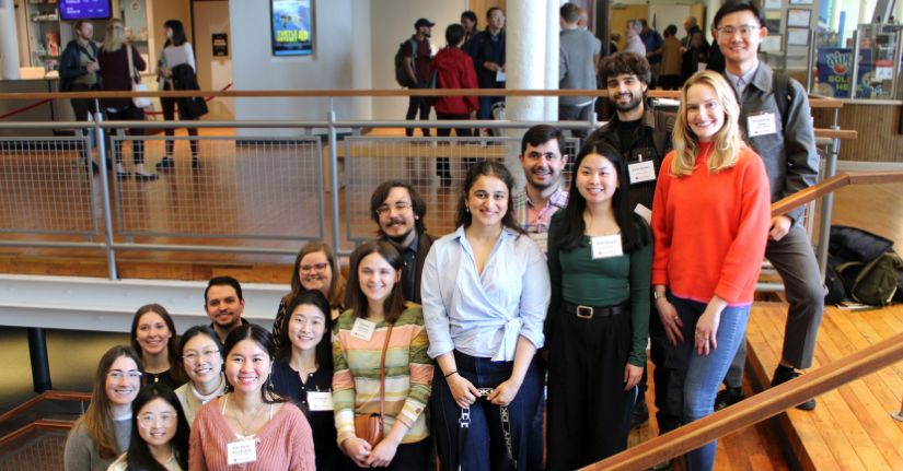 Group of students posing for photo on a staircase