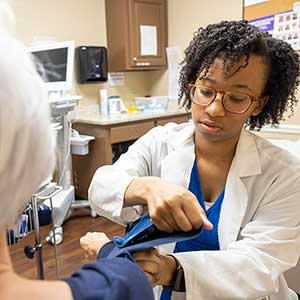 Rural pharmacists helps patient.
