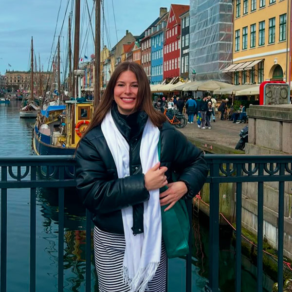 Anna Grace Maher in front of the water in Copenhagen