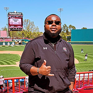 Jaron Coney gives the spurs up sign at Founders Park baseball stadium.