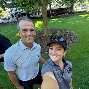 Abby Tabachini poses with Shane Beamer on the Horseshoe